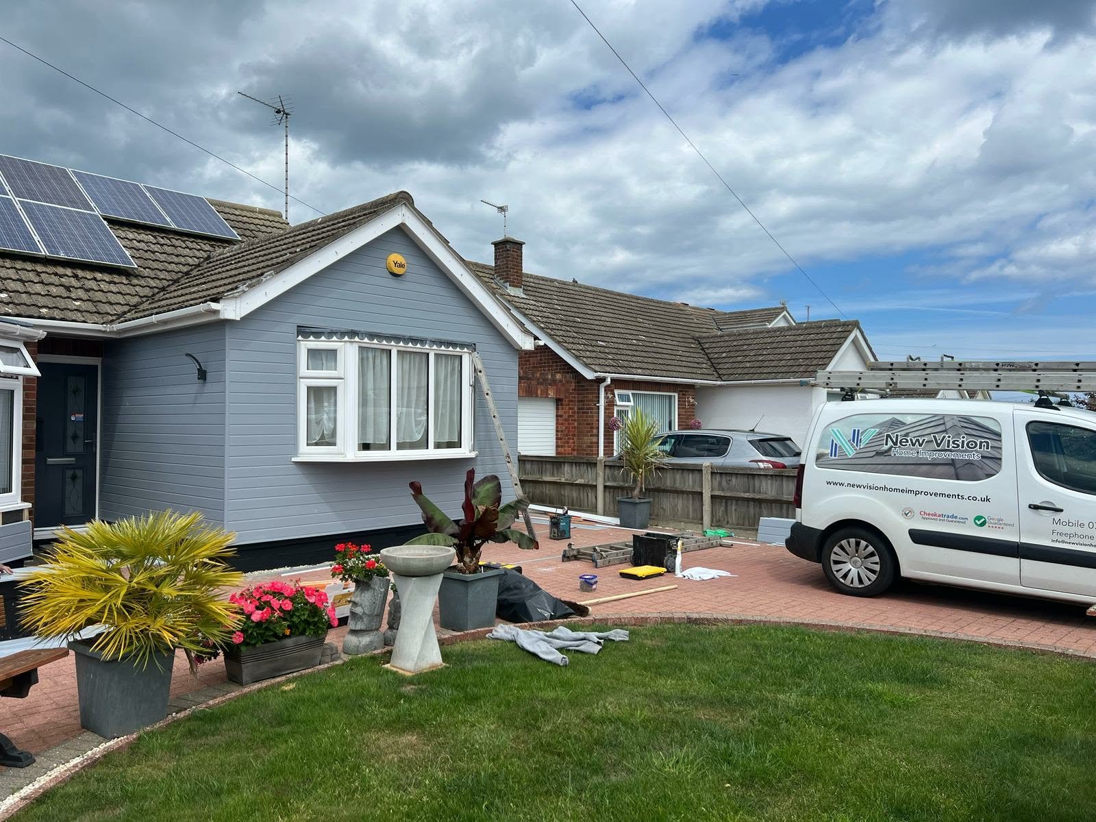 New Vision work van on roofing site.