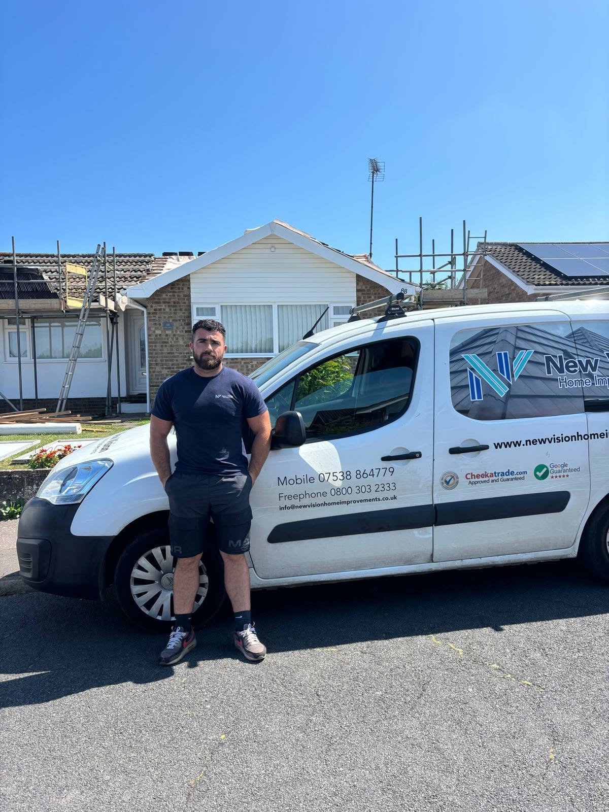 New Vision Owner, John, on roofing worksite.